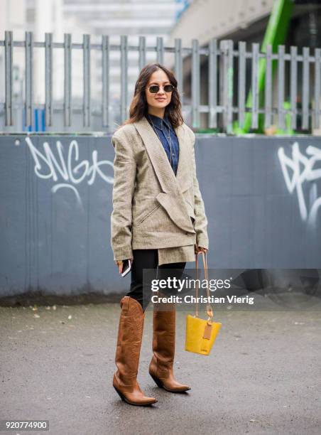 Anna Rosa Vitiello wearing brown boots seen outside Marques Almeida during London Fashion Week February 2018 on February 19, 2018 in London, England.