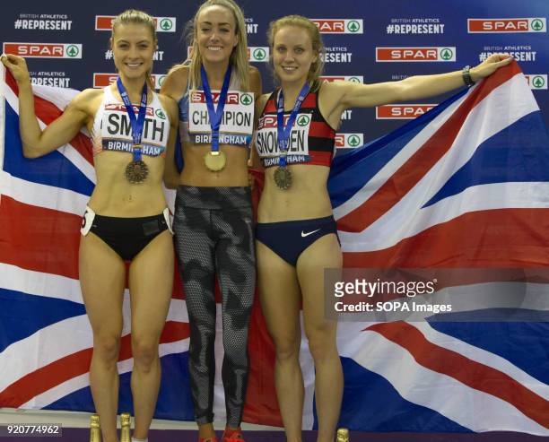 Elish McColgan, Katie Snowden and Stacey Smith pose with their medals in front of the GB flag during the medal ceremony for the Women's 1500m in...