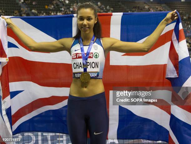 Great Britain's Morgan Lake poses with the GB flag after she won in the High Jump at the British National Indoor Championships in Birmingham.
