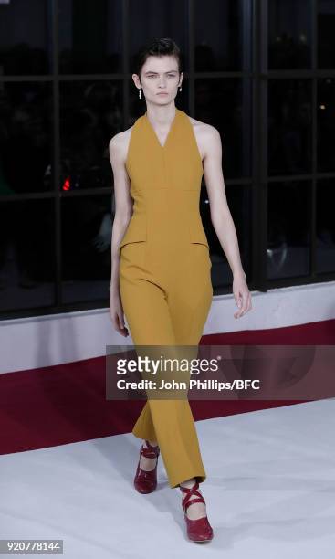 Model Lara Mullen walks the runway at the Emilia Wickstead show during London Fashion Week February 2018 at Great Portland Street on February 19,...