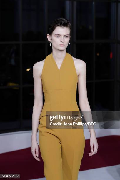 Model Lara Mullen walks the runway at the Emilia Wickstead show during London Fashion Week February 2018 at Great Portland Street on February 19,...