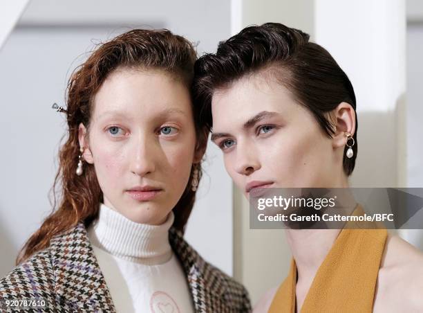 Models backstage ahead of the Emilia Wickstead show during London Fashion Week February 2018 at Great Portland Street on February 19, 2018 in London,...