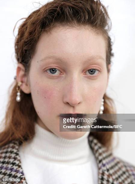 Model backstage ahead of the Emilia Wickstead show during London Fashion Week February 2018 at Great Portland Street on February 19, 2018 in London,...