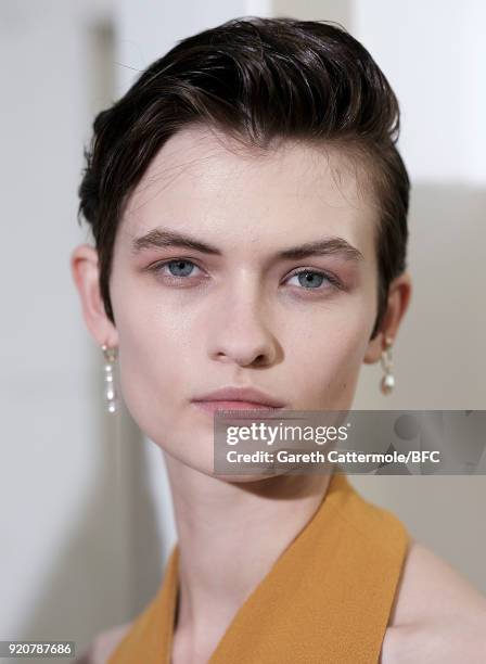 Model Lara Mullen backstage ahead of the Emilia Wickstead show during London Fashion Week February 2018 at Great Portland Street on February 19, 2018...