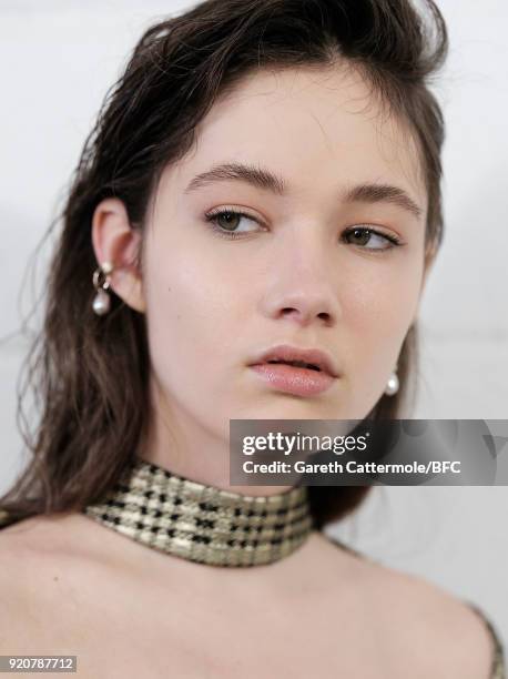 Model backstage ahead of the Emilia Wickstead show during London Fashion Week February 2018 at Great Portland Street on February 19, 2018 in London,...