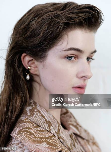 Model backstage ahead of the Emilia Wickstead show during London Fashion Week February 2018 at Great Portland Street on February 19, 2018 in London,...