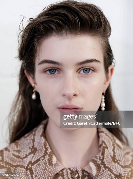 Model backstage ahead of the Emilia Wickstead show during London Fashion Week February 2018 at Great Portland Street on February 19, 2018 in London,...