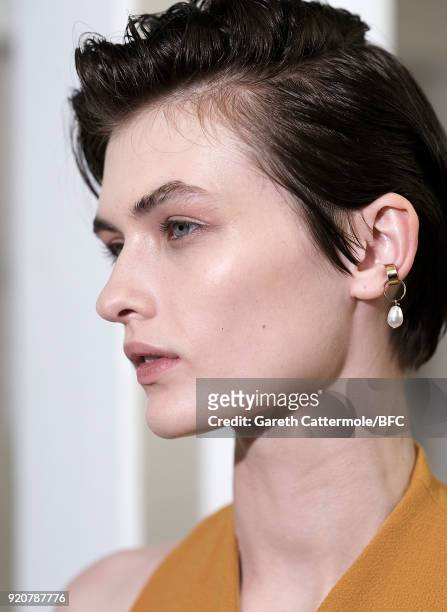 Model Lara Mullen backstage ahead of the Emilia Wickstead show during London Fashion Week February 2018 at Great Portland Street on February 19, 2018...