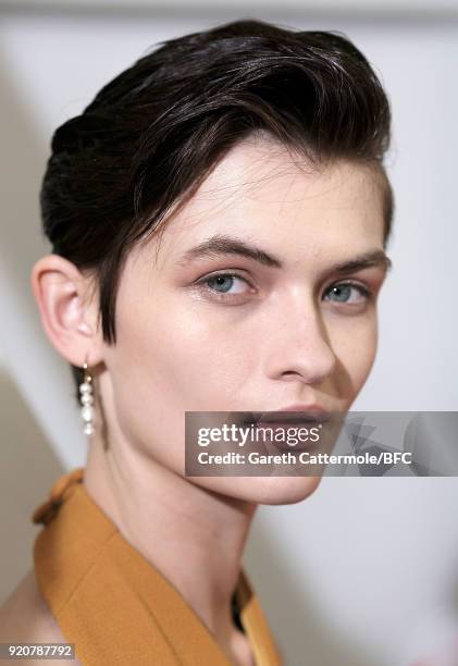 Model Lara Mullen backstage ahead of the Emilia Wickstead show during London Fashion Week February 2018 at Great Portland Street on February 19, 2018...