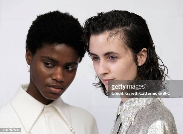 Models backstage ahead of the Emilia Wickstead show during London Fashion Week February 2018 at Great Portland Street on February 19, 2018 in London,...