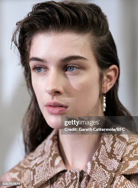 Model backstage ahead of the Emilia Wickstead show during London Fashion Week February 2018 at Great Portland Street on February 19, 2018 in London,...