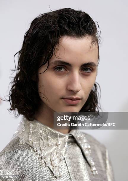 Model backstage ahead of the Emilia Wickstead show during London Fashion Week February 2018 at Great Portland Street on February 19, 2018 in London,...