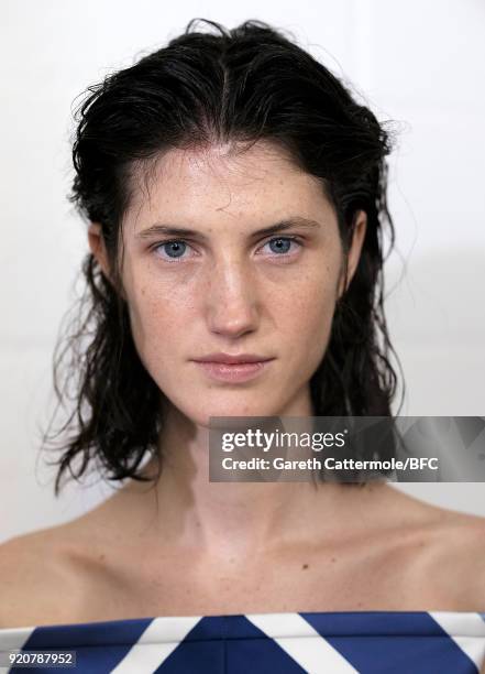 Model backstage ahead of the Emilia Wickstead show during London Fashion Week February 2018 at Great Portland Street on February 19, 2018 in London,...