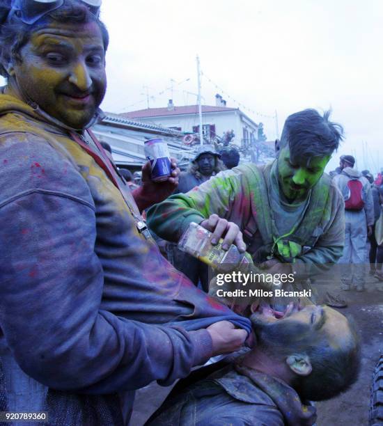 Local revellers celebrate 'Clean Monday' by throwing coloured flour at each other on February 19, 2018 in Galaxidi, Greece. Clean Monday, also known...