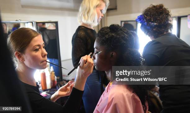 Models backstage ahead of the AV Robertson show during London Fashion Week February 2018 at St Andrews Church, Holborn on February 19, 2018 in...
