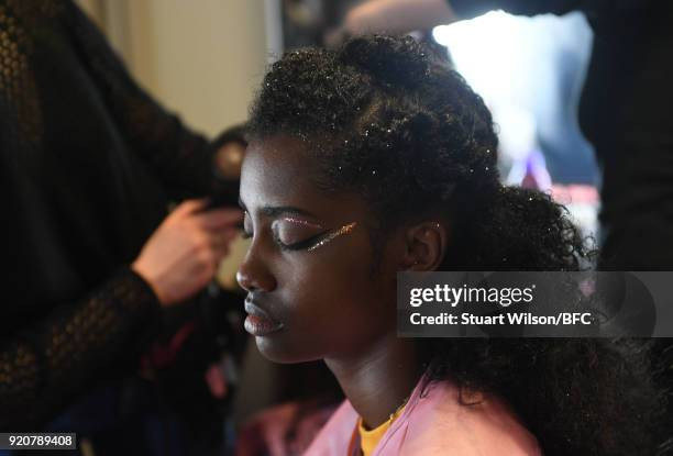 Models backstage ahead of the AV Robertson show during London Fashion Week February 2018 at St Andrews Church, Holborn on February 19, 2018 in...