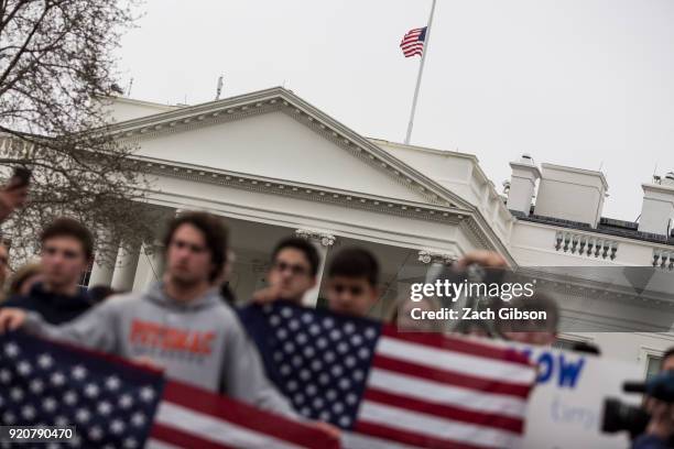 Flag flies a half staff above the White House as demonstrators gather during a demonstration supporting gun control reform on February 19, 2018 in...