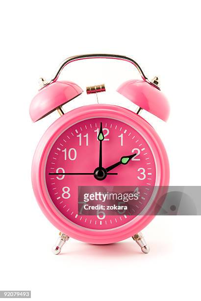 pink alarm clock with black hands - alarm clock white background stock pictures, royalty-free photos & images