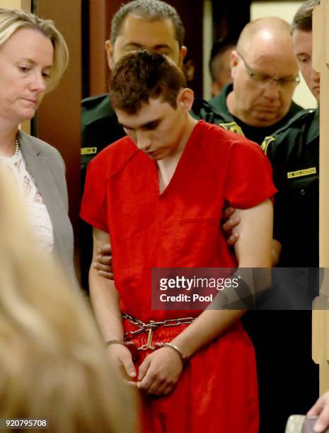 Nikolas Cruz appears in court with attorney Melissa McNeil for a status hearing before Broward Circuit Judge Elizabeth Scherer on February 19, 2018...