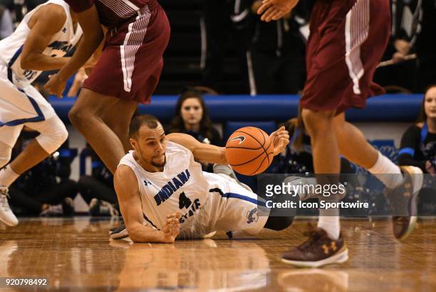 Indiana State Sycamores guard Brenton Scott hits the floor as he goes after a loose ball during the Missouri Valley Conference college basketball...
