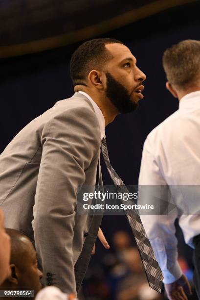 Southern Illinois Salukis assistant coach Justin Walker looks on during the Missouri Valley Conference college basketball game between the Southern...