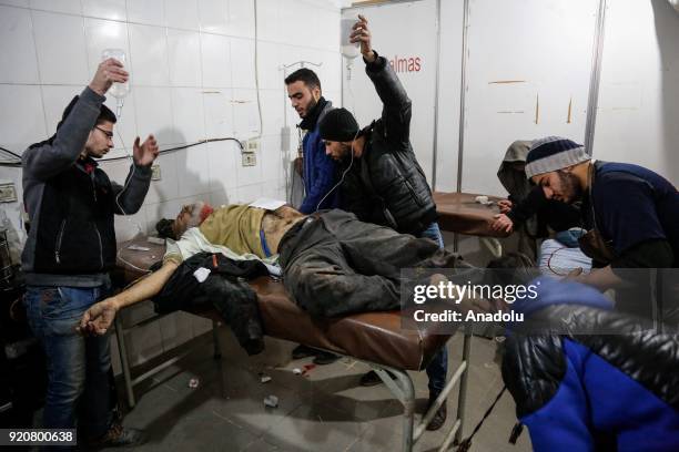 Syrian man receives medical treatment at the field hospital after Assad Regime's airstrikes and ground attacks to the Kafr Batna town which is a...