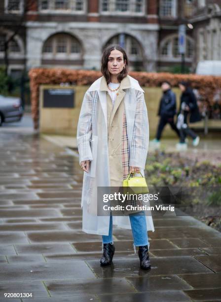 Erika Boldrin wearing transparent rain coat seen outside Christopher Kane during London Fashion Week February 2018 on February 19, 2018 in London,...