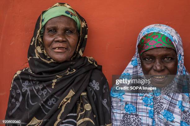 Two women seen posing for a photo in the remote village of Kpalong. Kpalong is 50kms outside Tamale in Northern Ghana. The Human Relief Foundation...