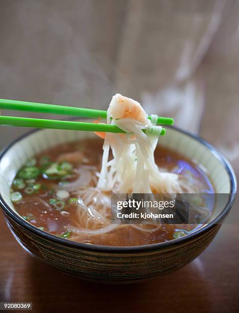 shrimp and noodles in chopstiks (pho tom) - rice noodles stock pictures, royalty-free photos & images