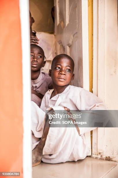 Two boys sit in the doorway of their classroom in the remote village of Kpalong. Kpalong is 50kms outside Tamale in Northern Ghana. The Human Relief...