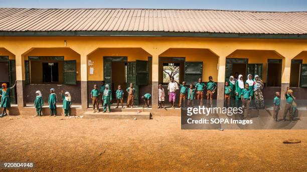 Group of children are seen standing outside their classrooms at a school in the remote village of Kpalong. Kpalong is 50kms outside Tamale in...