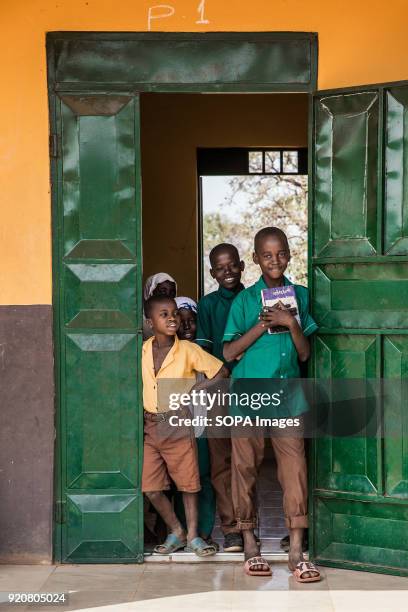 Group of children are seen posing in a doorway of a school in the remote village of Kpalong. Kpalong is 50kms outside Tamale in Northern Ghana. The...