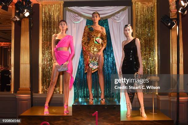 Models pose at the Sophia Webster AW18 presentation during London Fashion Week February 2018 at Hotel Cafe Royal on February 19, 2018 in London,...