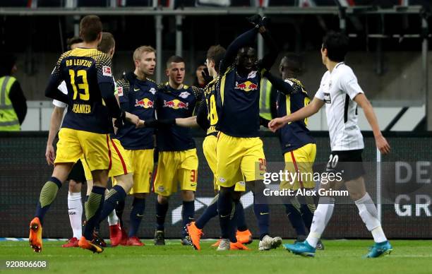 Jean Kevin Augustin of Leipzig celebratw with his team mates after he scores the openinig goal during the Bundesliga match between Eintracht...