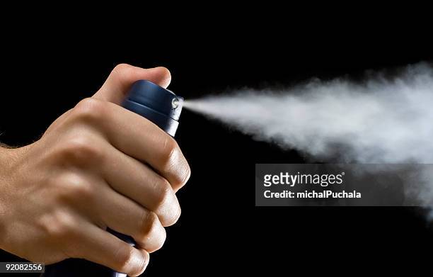 spraying deodorant - spray stock pictures, royalty-free photos & images