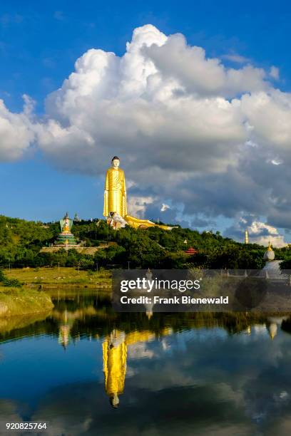 The Laykyun Sekkya Buddha and the Reclining Buddha statues are located on a hill in Maha Bodhi Ta Htaung near Khatakan Taung village, mirroring in a...