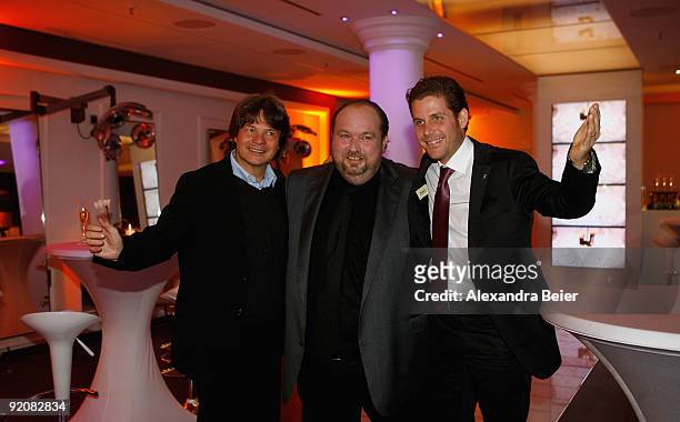 Munich's prominent hairdresser Wolfgang Lippert , event manager Philip Greffenius and caterer Michael Kaefer pose for photographers during the...