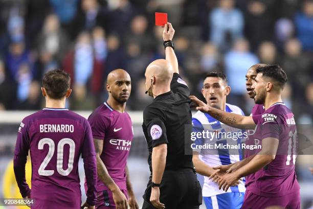 WIGAN, ENGLAND Fabian Delph of Manchester City is shown a red card by referee Anthony Taylor during the Emirates FA Cup Fifth Round match between...
