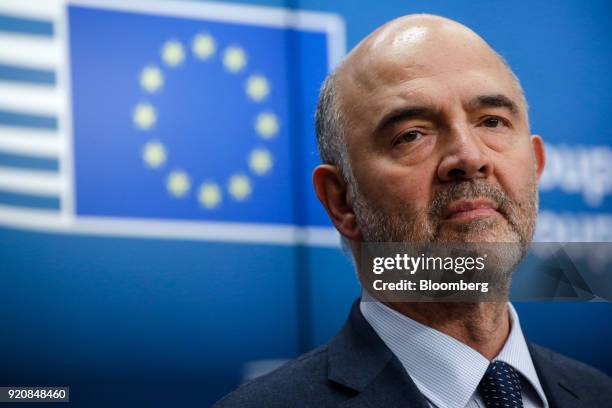 Pierre Moscovici, economic commissioner for the European Union , looks on during a news conference following a Eurogroup finance ministers meeting in...