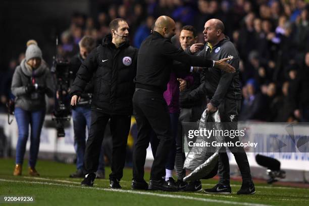 Josep Guardiola, Manager of Manchester City argues with Paul Cook, Manager of Wigan Athletic during the Emirates FA Cup Fifth Round match between...