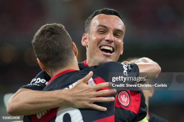 Oriol Riera of the Wanderers celebrates kicking a goal with captain Mark Bridge during the round one A-League match between the Western Sydney...