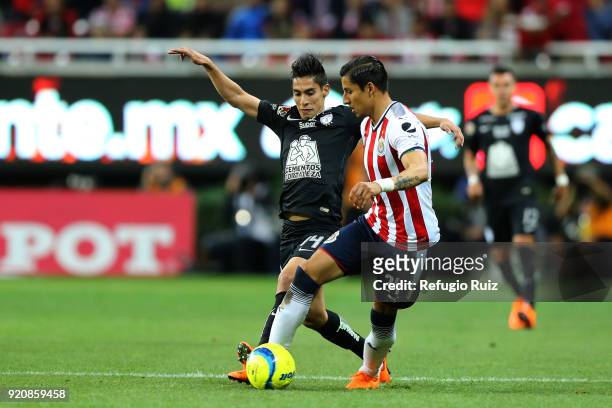 Carlos Cisneros of Chivas fights for the ball with Erick Aguirre of Pachuca during the 8th round match between Chivas and Pachuca as part of the...