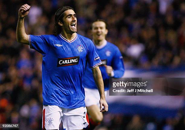 Pedro Mendes of Rangers celebrates after scoring against Unirea Urziceni during the UEFA Champions League Group G match between Rangers and Unirea...