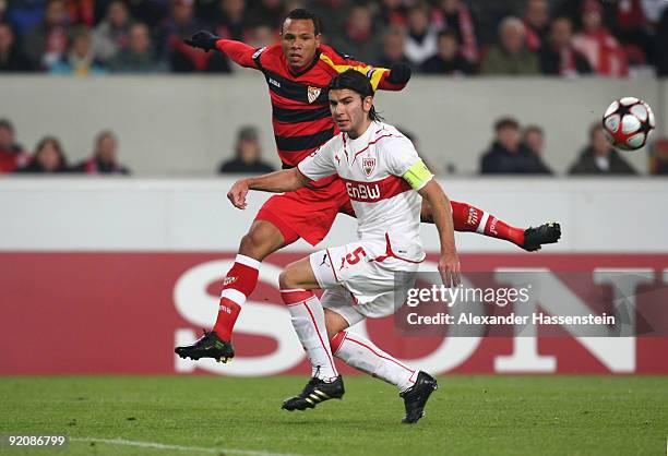 Serdar Tasci of Stuttgart battles for the ball with Luis Fabiano of Sevilla during the UEFA Champions League Group G match between VfB Stuttgart and...