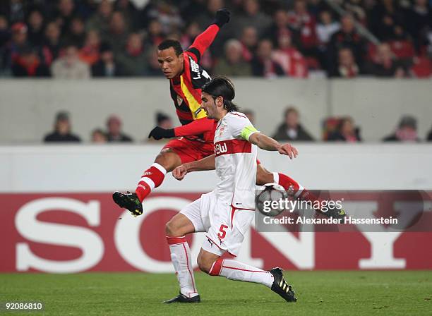 Serdar Tasci of Stuttgart battles for the ball with Luis Fabiano of Sevilla during the UEFA Champions League Group G match between VfB Stuttgart and...