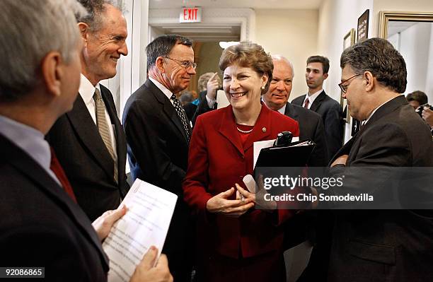 Sen. Jack Reed , Sen. Ted Kaufman , Sen. Paul Kirk , Sen. Jeanne Shaheen , Sen. Ben Cardin ; and Sen. Al Franken prepare to begin a news conference...