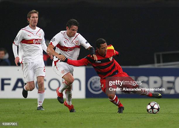 Christian Traesch of Stuttgart and his team mate Aleksander Hleb battle for the ball with Adriano of Sevilla during the UEFA Champions League Group G...