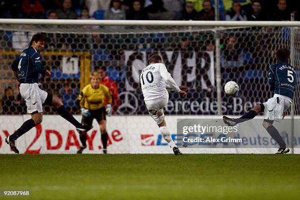 Thomas Haessler takes a shot on the goal against Uwe Krupp and Thomas Helmer during the charity football match "Klitschko meets Becker" at the...