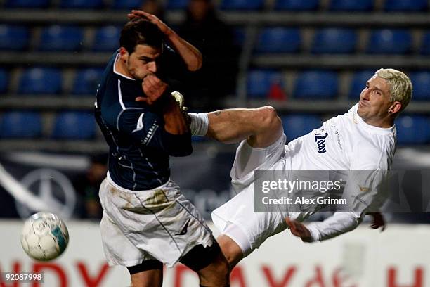 Stefan Kretzschmar shoots the ball ahead of Tobias Licht during the charity football match "Klitschko meets Becker" at the Carl-Benz stadium on...