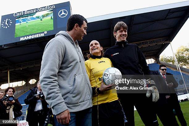 Nadine Angerer poses with Richard Golz and Vladimir Klitschko before the charity football match "Klitschko meets Becker" at the Carl-Benz stadium on...